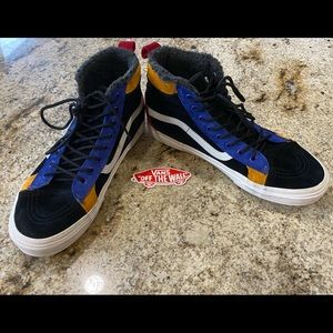 Red, black, blue and yellow suede high top vans